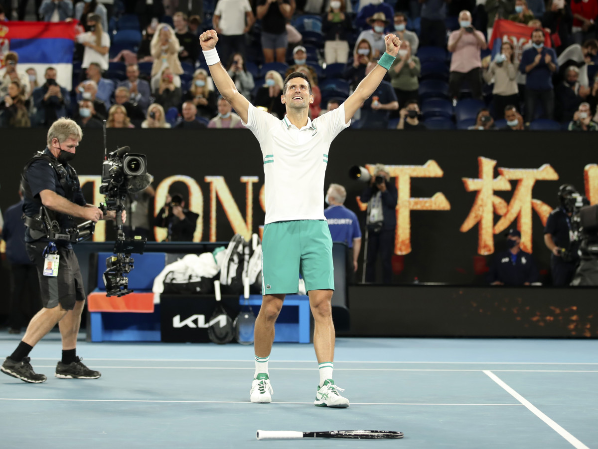 Serbia's Novak Djokovic celebrates after winning the men's singles final against Russia's Daniil Medvedev at Australian Open in Melbourne Park in Melbourne, Australia, Feb. 21, 2021.